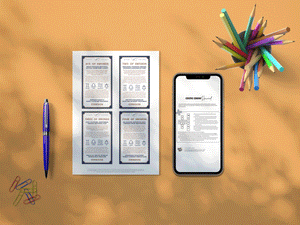 A piece of paper with four tarot cards on it is laying on a yellow table. To the right of the paper is a phone. There is a jar full of pencils and a stack of paper clips.